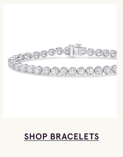 Silver tennis bracelet with continuous line of round-cut diamonds. Click here to shop bracelets
