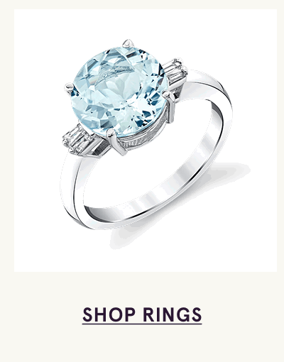 Silver ring with large, round light blue aquamarine centre stone. Click here to shop rings