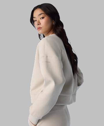 A woman wearing a white sweat set.