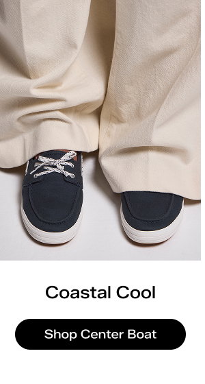 The Center III Boat Twill Slip-On in navy blazer paired with oversized beige trousers.  Coastal Cool Shop the Center Boat