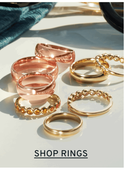 Pile of stacking rings. Click to Shop Rings