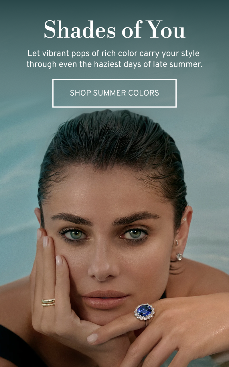 Model Taylor Hill in pool wearing a blue gemstone ring. Shades of You. Vibrant pops of color. Click to Shop Summer Colors
