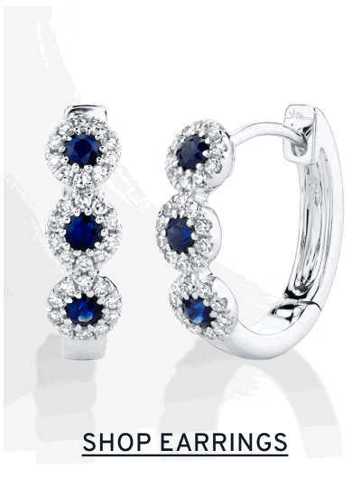 Pair of sapphire hoop earrings. Click to Shop Earrings