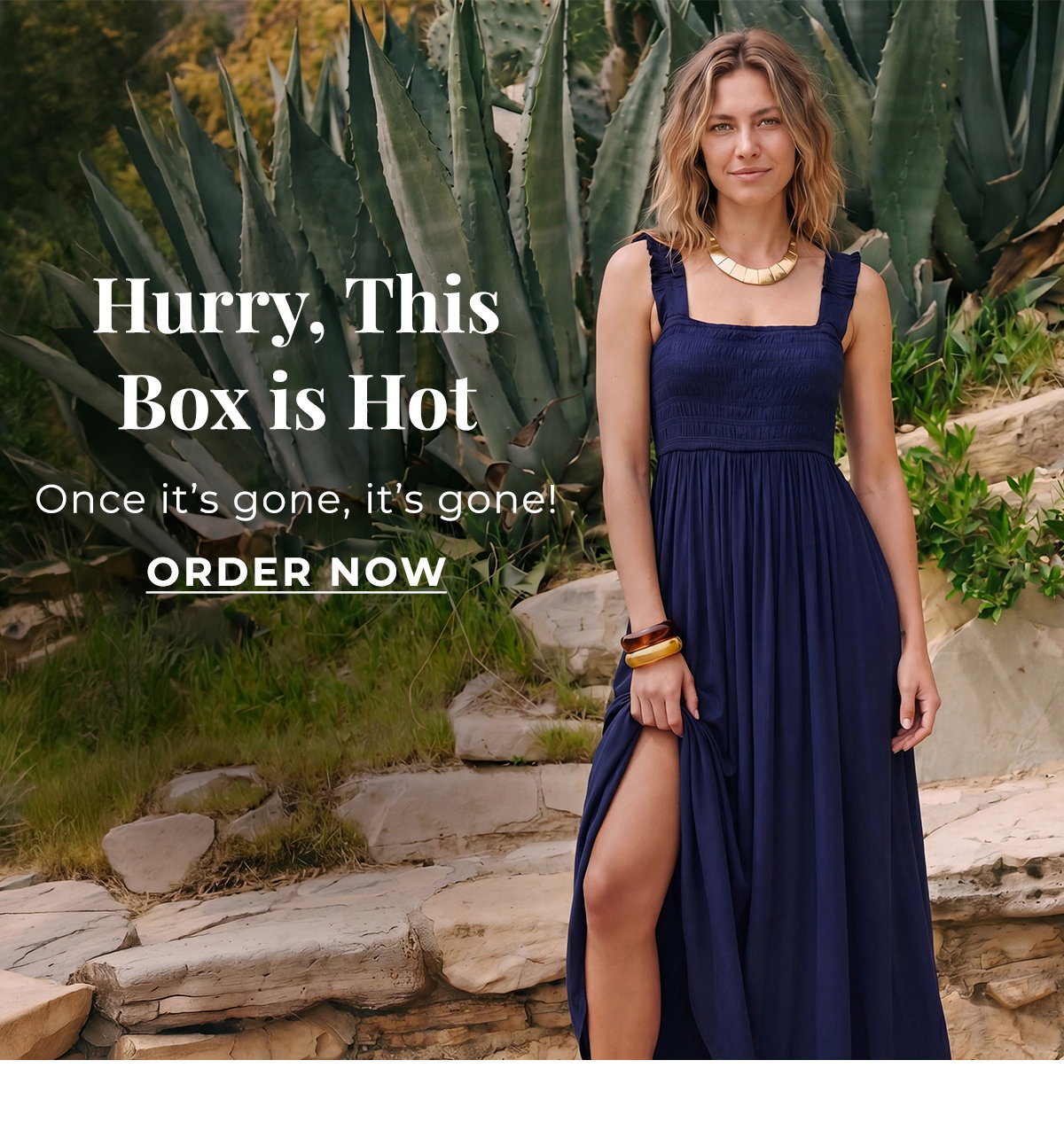 Woman wearing a navy maxi dress beside agave plants for an End of Season Sale.