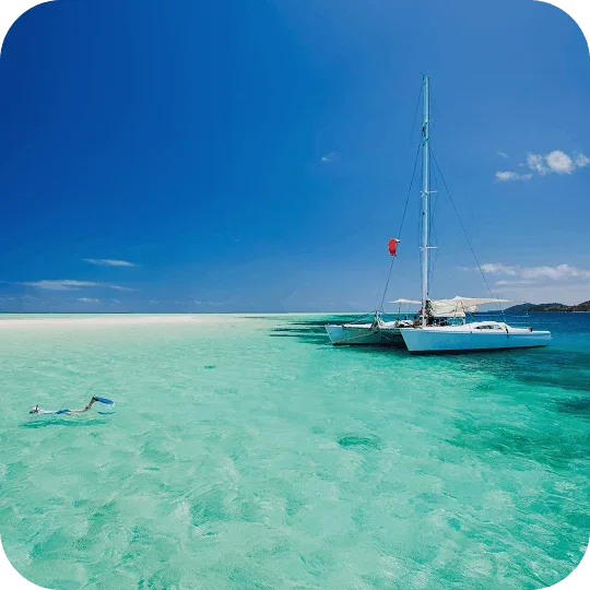 Person snorkelling in clear turquoise water