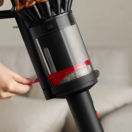 Dyson CleanCompaktor bin compressing dust in the vacuum.