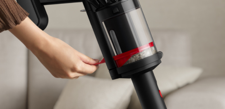 Dyson CleanCompaktor bin compressing dust in the vacuum.