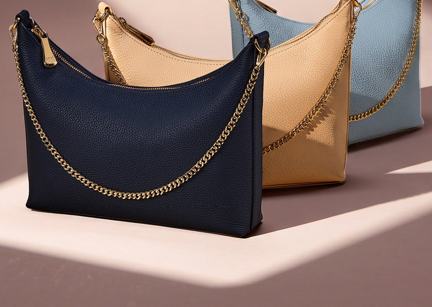 The Jules in Navy, Cappuccino, and Coastal Blue.