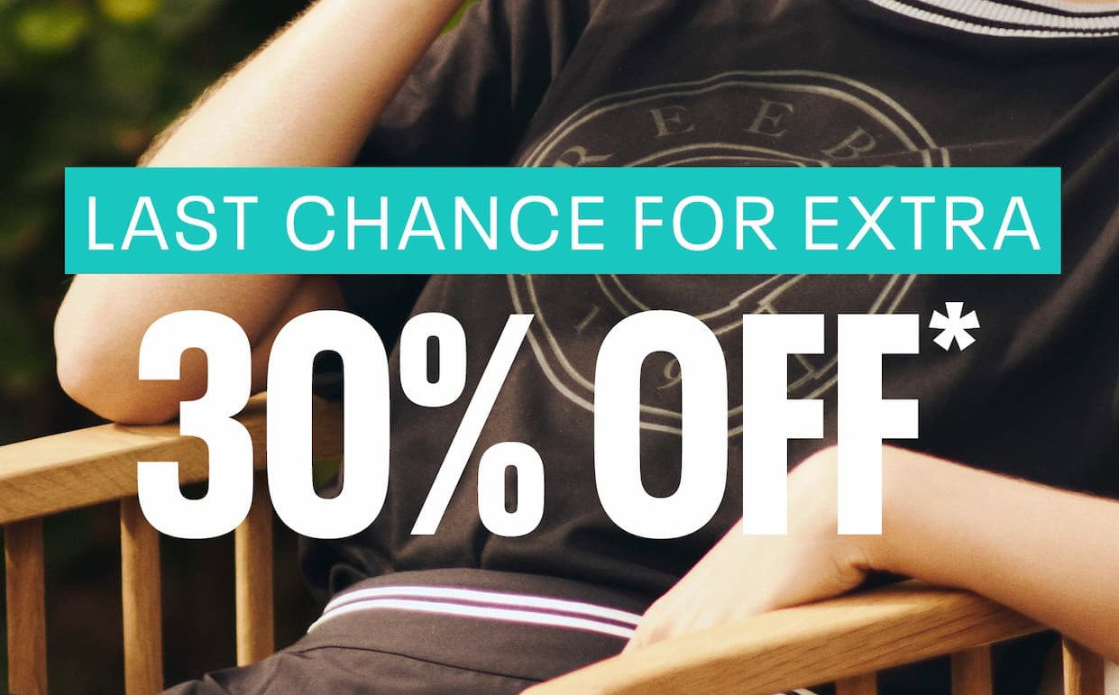 Close-up of a Reebok heritage logo T-shirt. Text reads: “LAST CHANCE FOR EXTRA 30% OFF.”