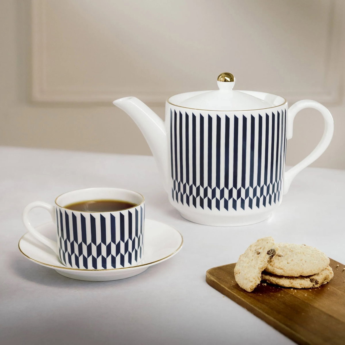 image of chelsea collection tea pot and sloane mug with biscuits on side