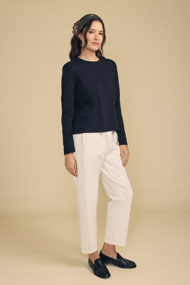 Image shows a model wearing the Laney Pants in Beach. Text reads: Elastic Waist. Side Slah Pockets. Soft Pinwale Corduroy.