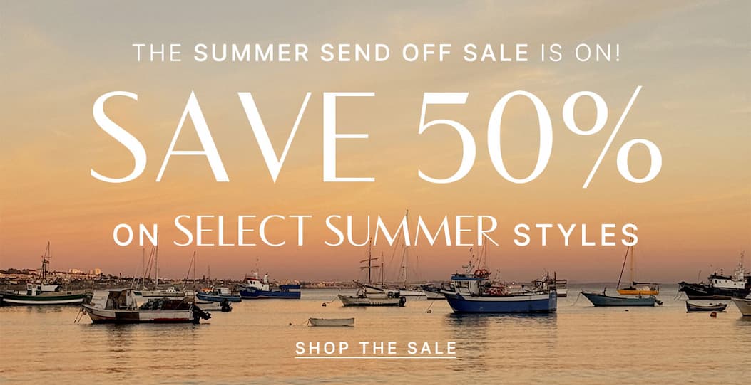 Summer Send Off Sale banner over a harbor at sunset. Text: Save 50% on select summer styles. Shop Now.