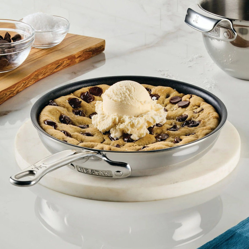 IMG: Chocolate chip cookie topped with ice cream in Hestan ProBond Luxe® Polished Clad Stainless Steel Skillet with TITUM® Nonstick