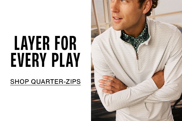 Model wearing a white textured quarter-zip over a patterned shirt. Text reads: 