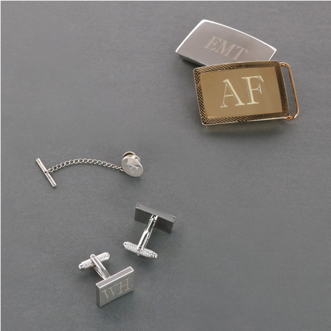 Men's jewelry pieces featuring buckles, cufflinks