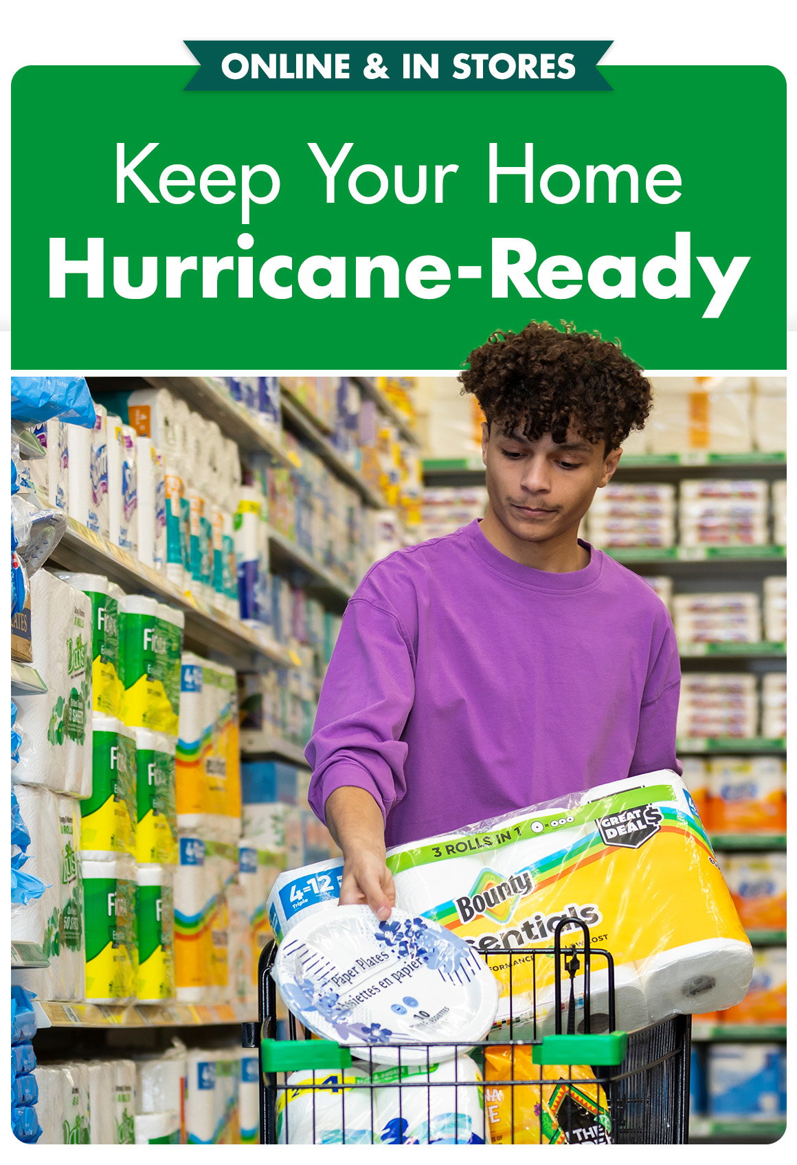 Keep your home storm-ready. Image of a young man adding paper towels and paper plates to a shopping cart in Dollar Tree.