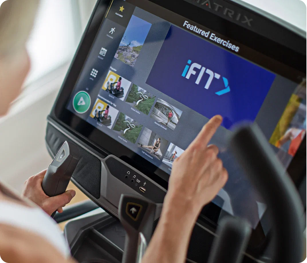 Close-up of a Matrix touchscreen console displaying workout programs.
