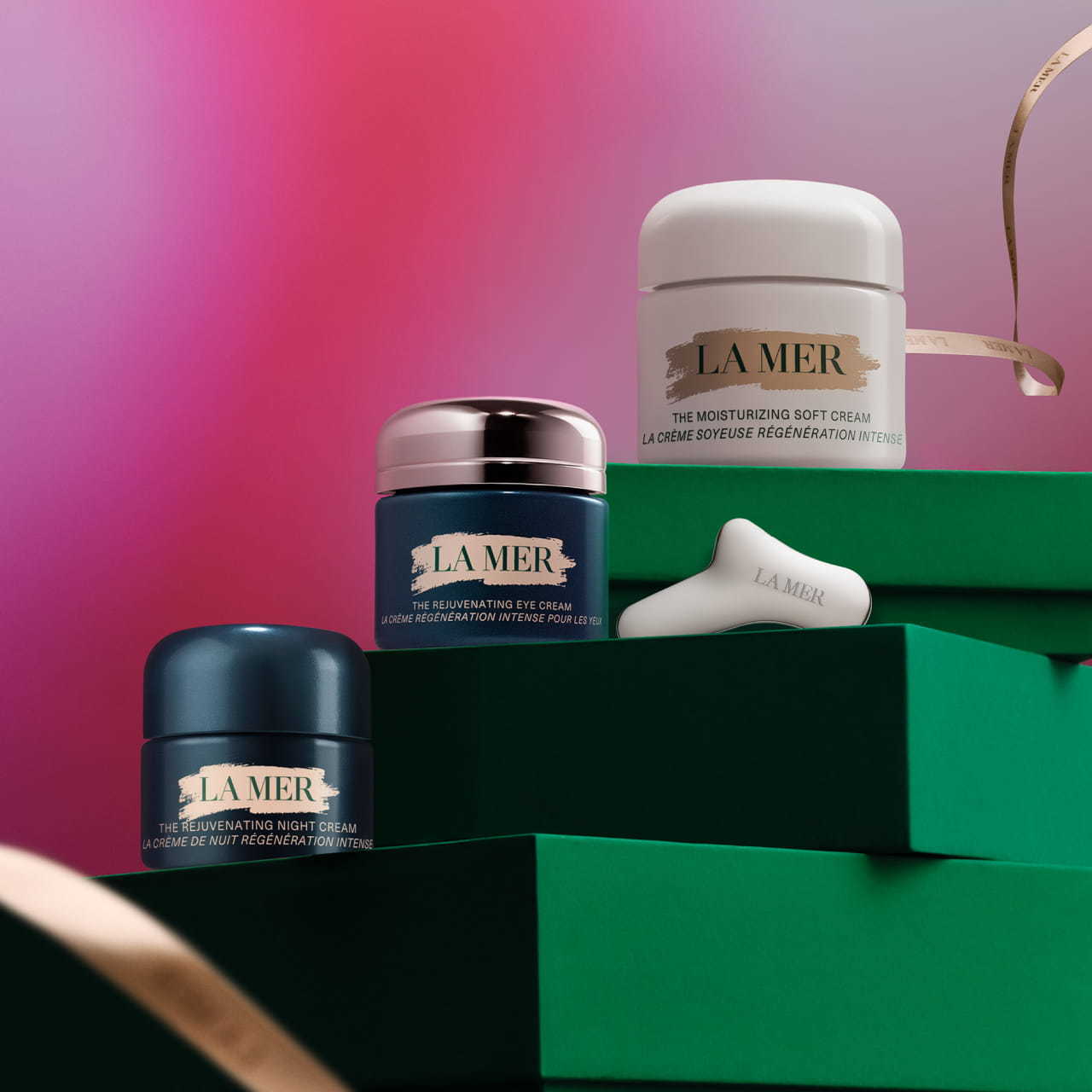 Jar of the new Rejuvenating Eye Cream with the Rejuvenating Eye Tool on the left.
