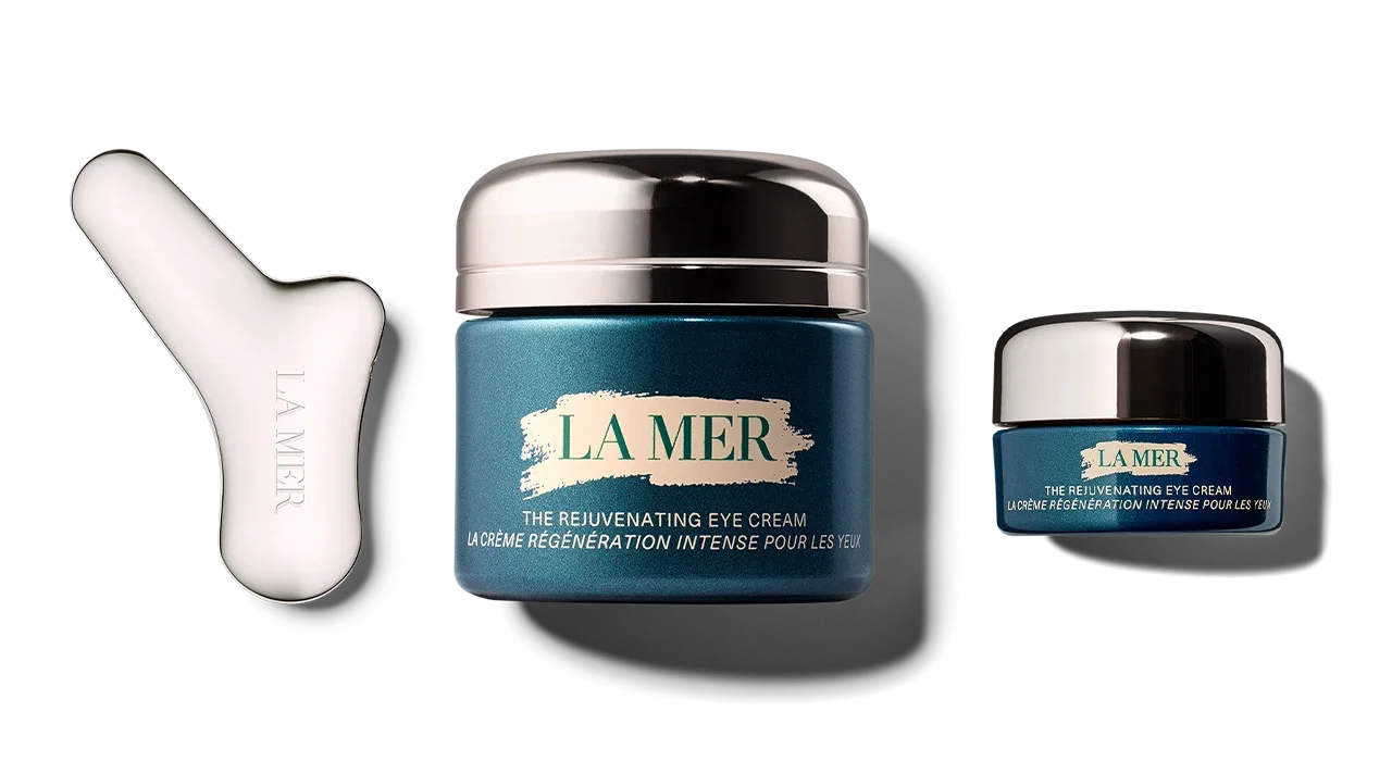Jar of the new Rejuvenating Eye Cream with the Rejuvenating Eye Tool on the left.