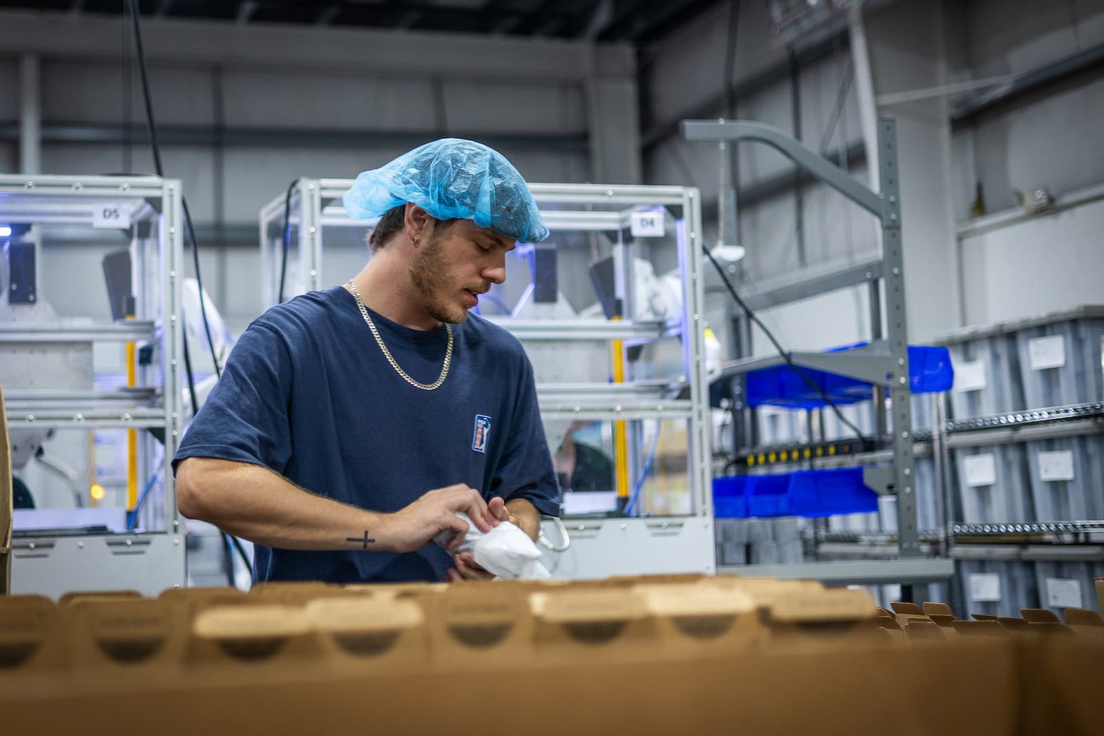 Epic Water Filters team member packing customer orders in the warehouse.