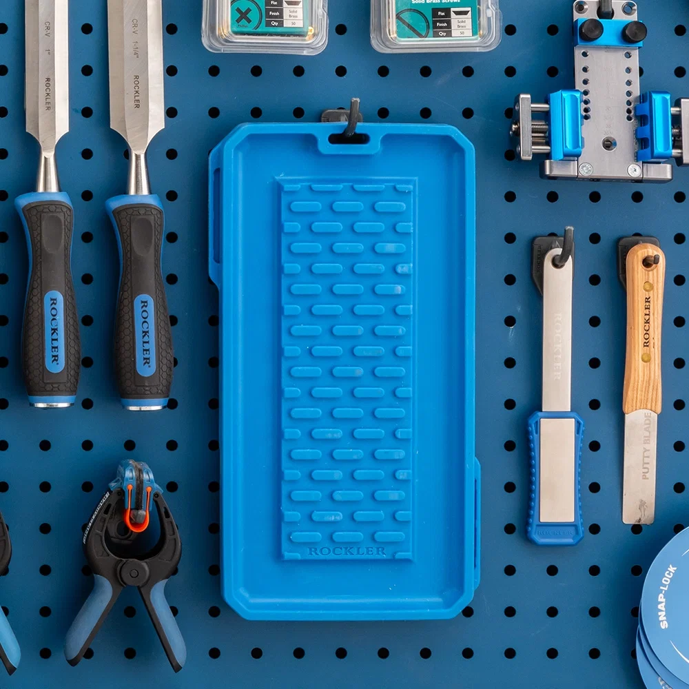 Chisels and sharpening base on pegboard