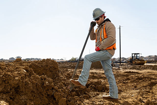 A man wearing the Markout 11" Steel Toe work boots in Brown.