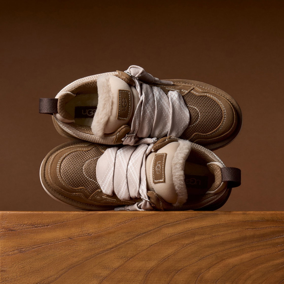 The Lowmel trainer stacked on a wooden background.