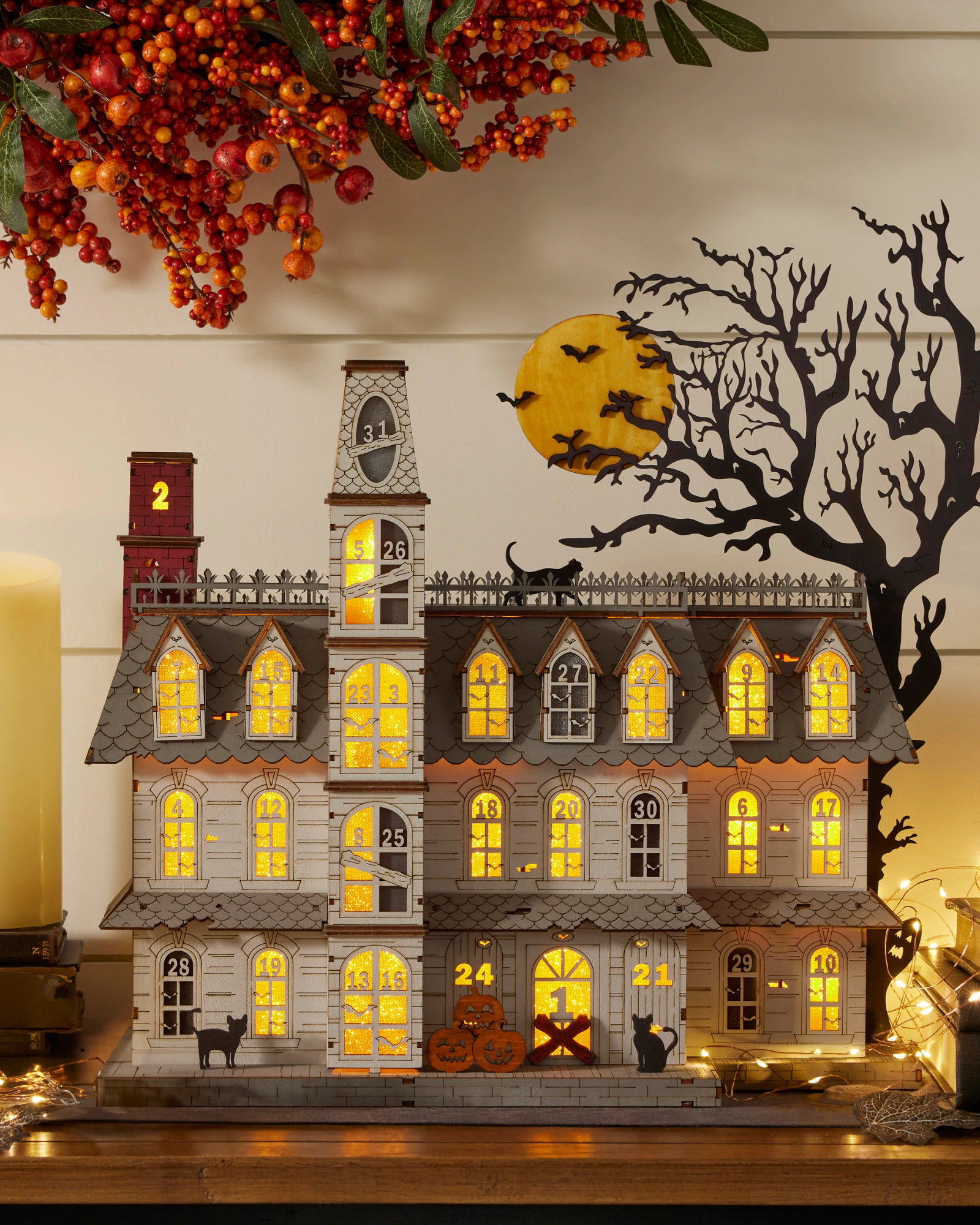 Image of Lit Wooden Spooky Manor Halloween Countdown Calendar