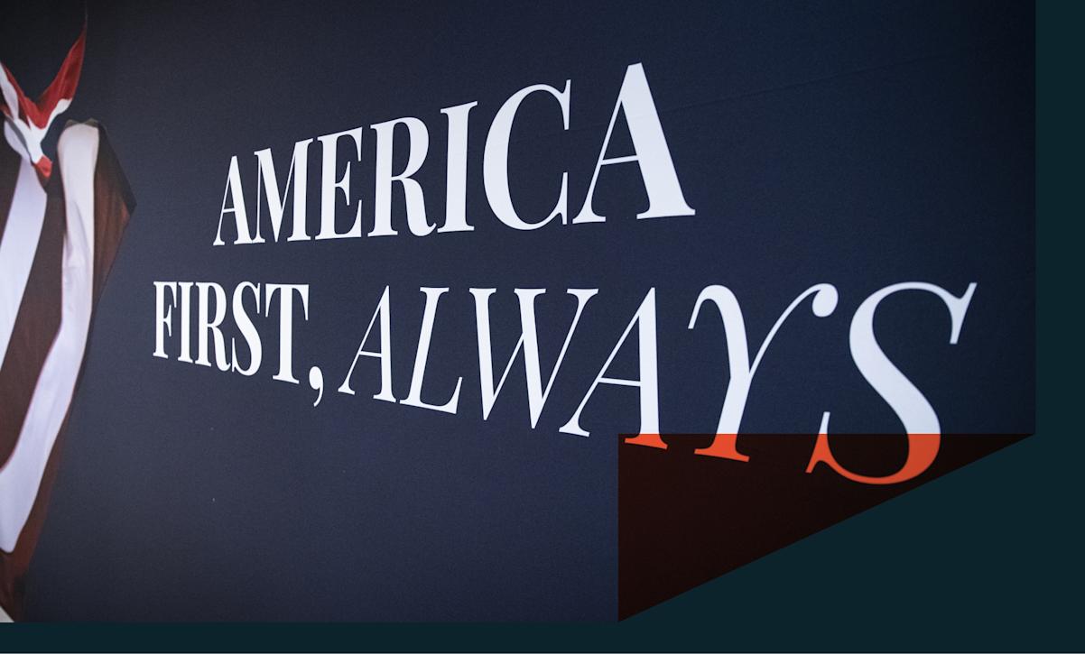 An "America First" mural is displayed on a wall. 