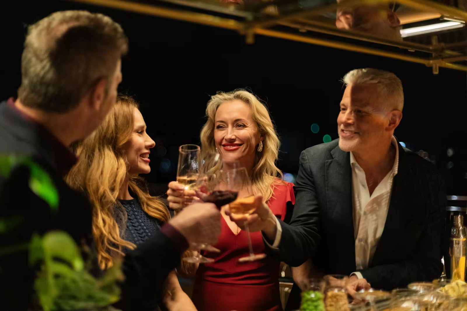 Guests enjoying wine and canapes aboard a river cruise ship