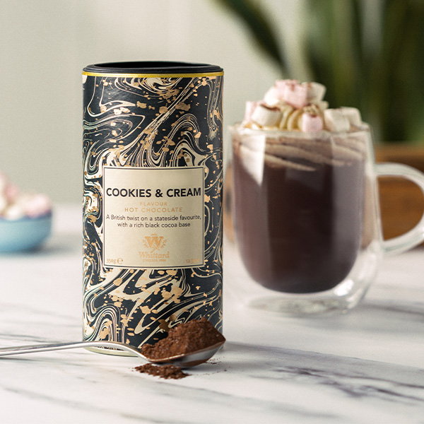 image of cookies and cream hot chocolate tub with made up drink in Nova glass