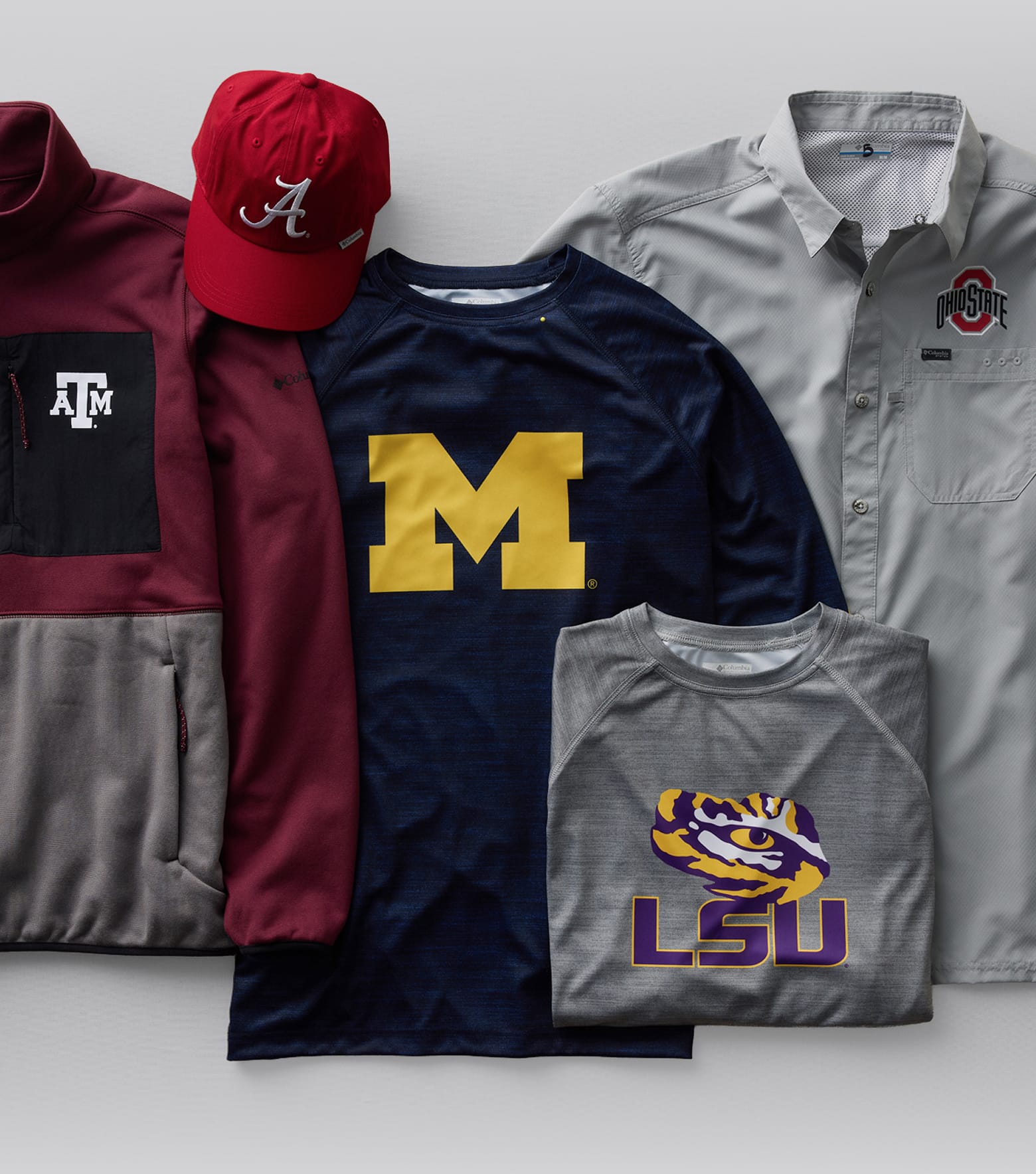 Flatlay of miscellaneous team gear against a gray background.