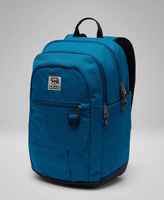 A blue backpack against a gray background.
