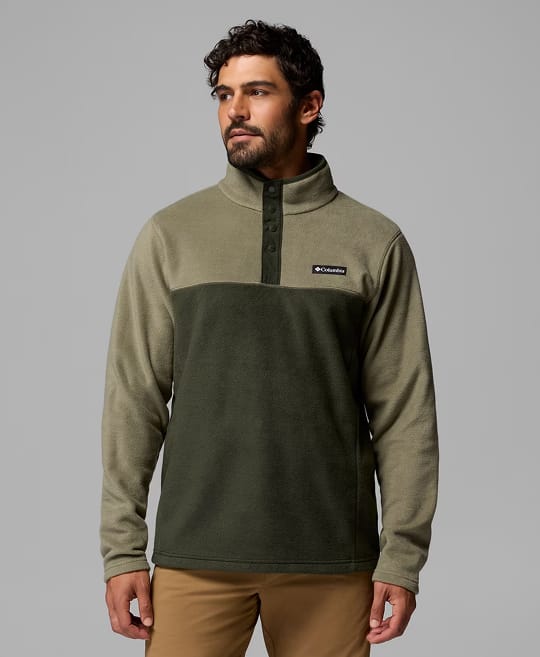 A man wearing a green fleece pullover.