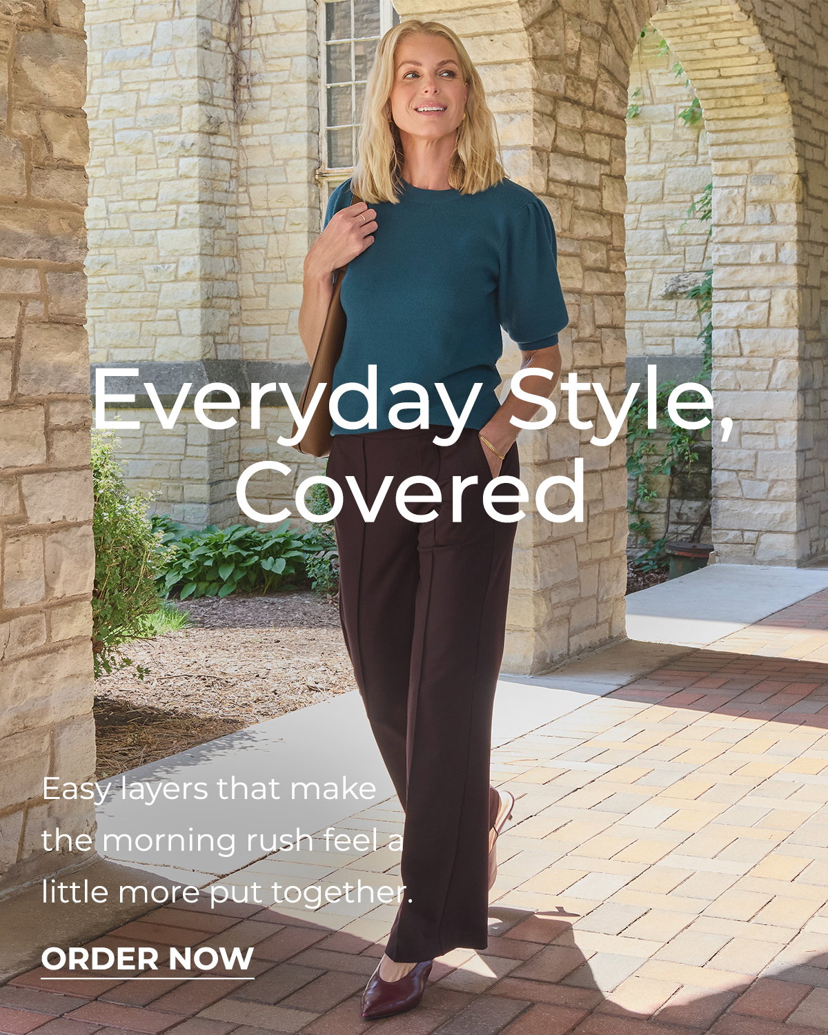 Woman in teal top and brown trousers models a polished back to school outfit.