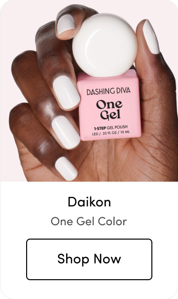 Hand holding a round white One Gel polish bottle with matching white nails, labeled 