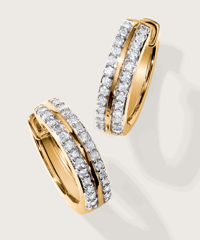 Yellow gold hoop earrings with two rows of pavé diamonds.