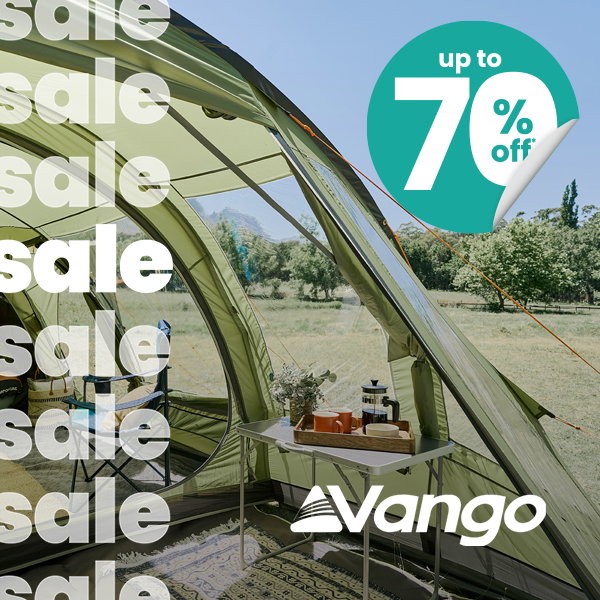 Interior view of a Vango camping tent with a table, lantern, and camping accessories overlooking a grassy outdoor setting. Promotional graphic includes repeated “sale” text, Vango logo, and “Up to 70% Off” badge.