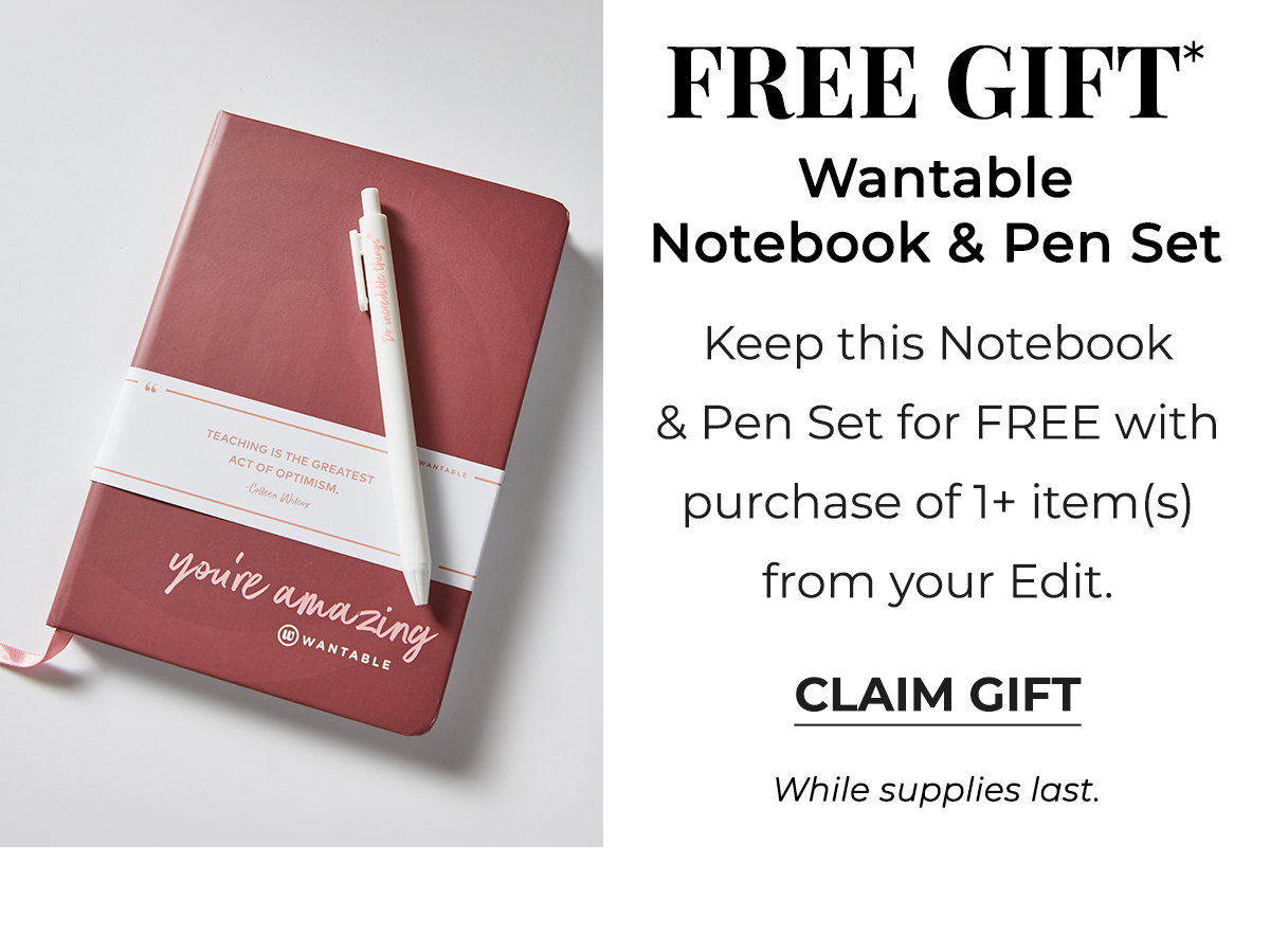 Red Wantable notebook and white pen set arranged for back to school planning.