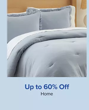 Up to 60% off home. Shop now. A made bed with matching blue bed spread.