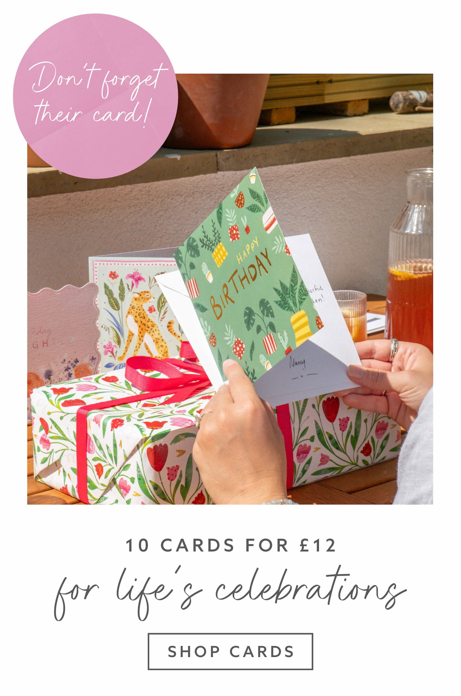 Birthday card displayed alongside a beautifully wrapped gift, highlighting Whistlefish's 10 cards for £12 offer.