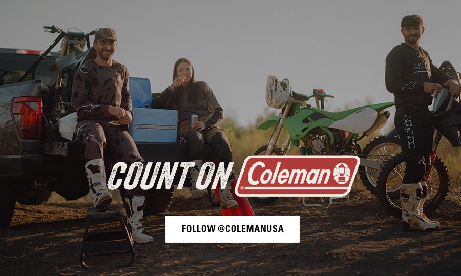 Three people in motocross gear sit and stand near a pickup truck and dirt bikes outdoors. Text says count on Coleman. Button says follow at Colemanusa.