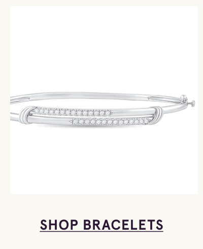 Sleek silver bangle bracelet with dual horizontal bars covered in pavé stones. Click here to shop bracelets