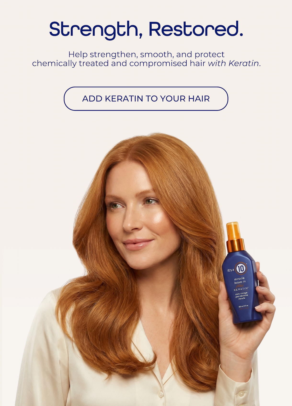 Redhead model holding It's a 10 Miracle Leave-In Plus Keratin