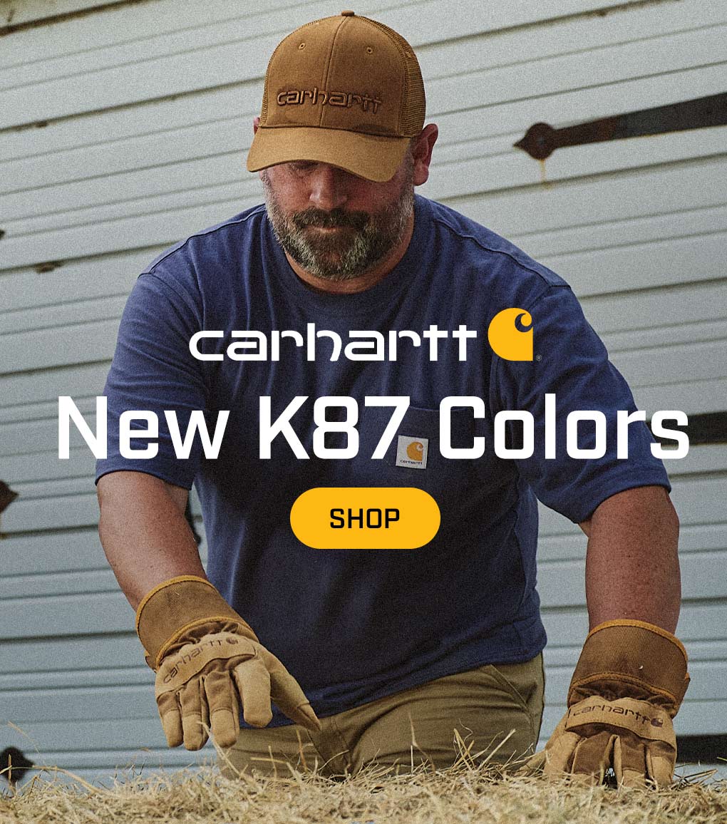 A man working outside in a new K87 t-shirt