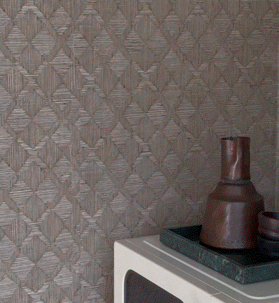 Gif image showing Tempaper's Hoffman Sisal wallpaper in tan by Jeremiah Brent installed on wall sin a dorm room.