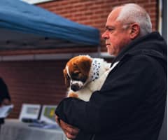 Man holding puppy