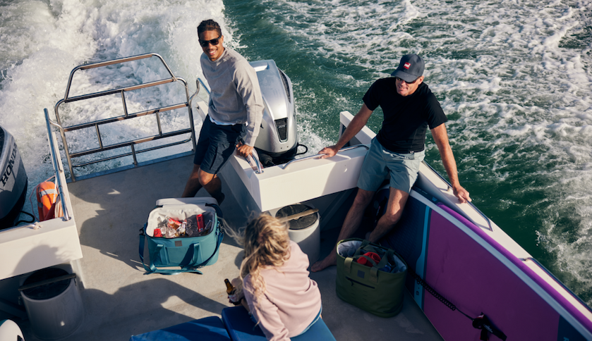 Group on boat with waterproof soft cooler, 30L