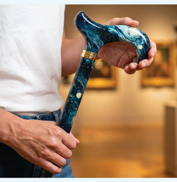 man holding stylish cane
