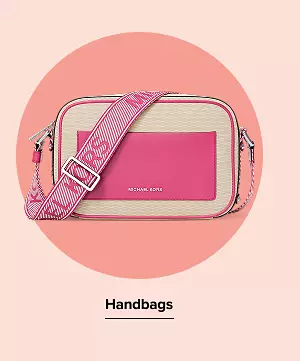 A pink crossbody bag. Handbags.